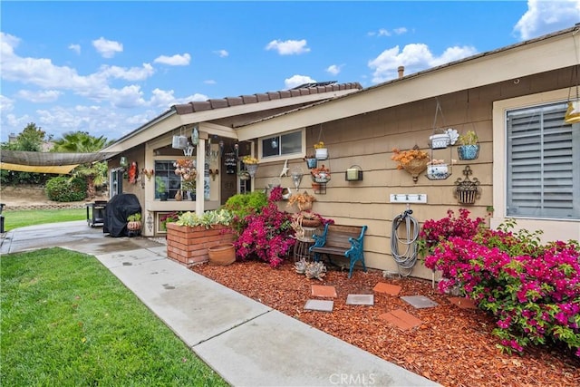 42065 Kaffirboom Ct, Temecula, CA 92591 - doorway to property with a lawn and a tiled roof
