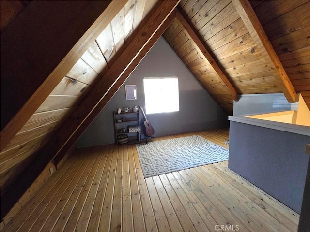 bonus room with wood-type flooring, wood ceiling, and lofted ceiling