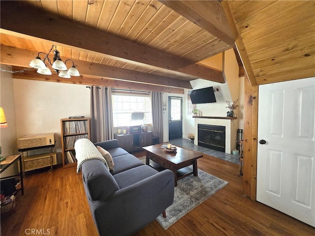 143 Cedar Ln, Sugarloaf, CA 92386 - living area featuring beam ceiling, wood finished floors, a fireplace with flush hearth, wood ceiling, and a chandelier
