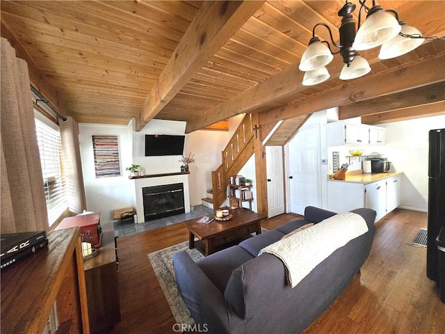143 Cedar Ln, Sugarloaf, CA 92386 - living area with wood finished floors, a chandelier, beam ceiling, a fireplace with flush hearth, and wood ceiling