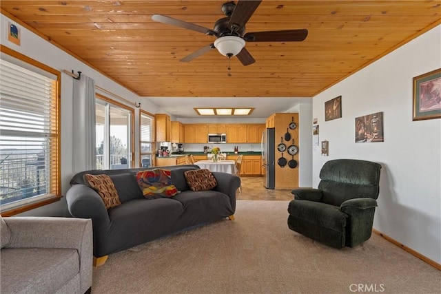 living room with ceiling fan, light colored carpet, wooden ceiling, and baseboards