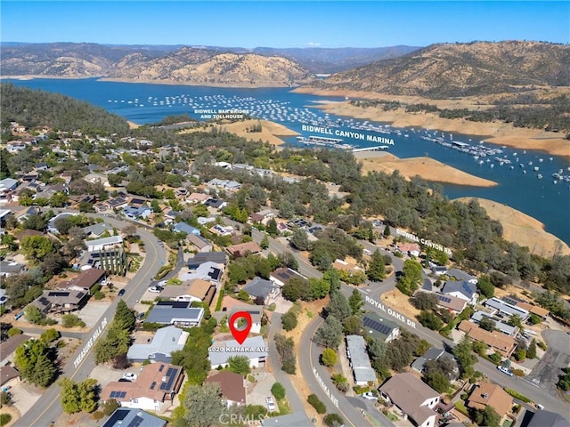 birds eye view of property featuring a residential view and a water and mountain view