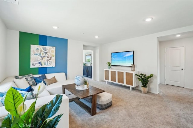 carpeted living area featuring recessed lighting