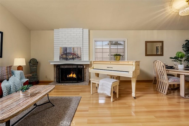 6192 Sierra Siena Rd, Irvine, CA 92603 - living room featuring baseboards, a fireplace, and wood finished floors