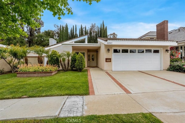 6192 Sierra Siena Rd, Irvine, CA 92603 - view of front facade with an attached garage, stucco siding, driveway, and a front yard