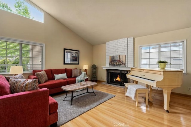 6192 Sierra Siena Rd, Irvine, CA 92603 - living area featuring baseboards, a brick fireplace, wood finished floors, and high vaulted ceiling
