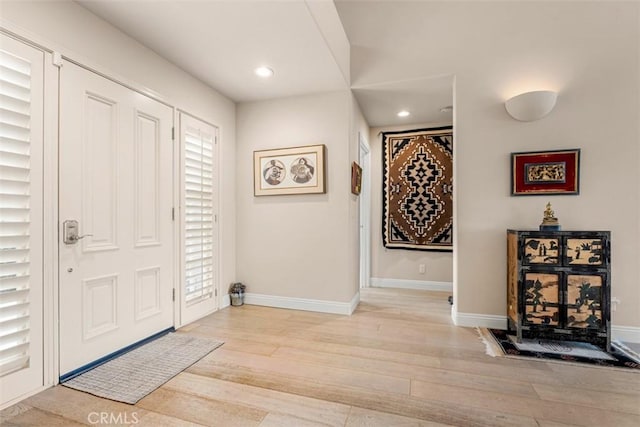 20 Delphinus Unit 20, Irvine, CA 92603 - entrance foyer featuring recessed lighting, baseboards, wood finished floors, and a healthy amount of sunlight