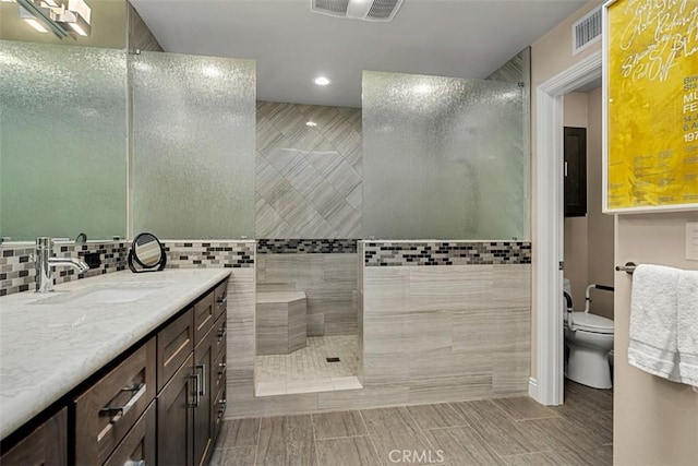 20 Delphinus Unit 20, Irvine, CA 92603 - bathroom featuring visible vents, walk in shower, vanity, toilet, and recessed lighting