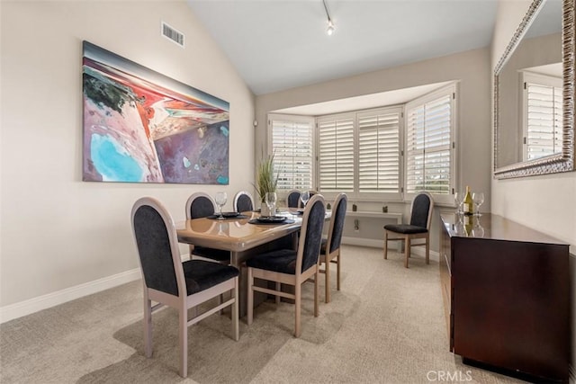 20 Delphinus Unit 20, Irvine, CA 92603 - carpeted dining space featuring baseboards, lofted ceiling, and visible vents