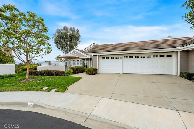20 Delphinus Unit 20, Irvine, CA 92603 - ranch-style house featuring an attached garage, driveway, a tile roof, and a front yard