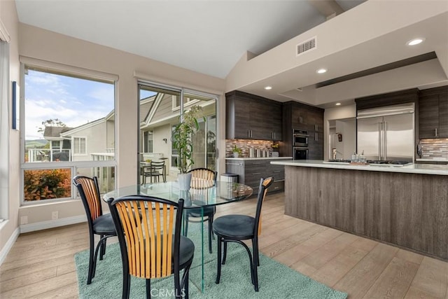 20 Delphinus Unit 20, Irvine, CA 92603 - dining room with plenty of natural light, recessed lighting, light wood finished floors, and lofted ceiling