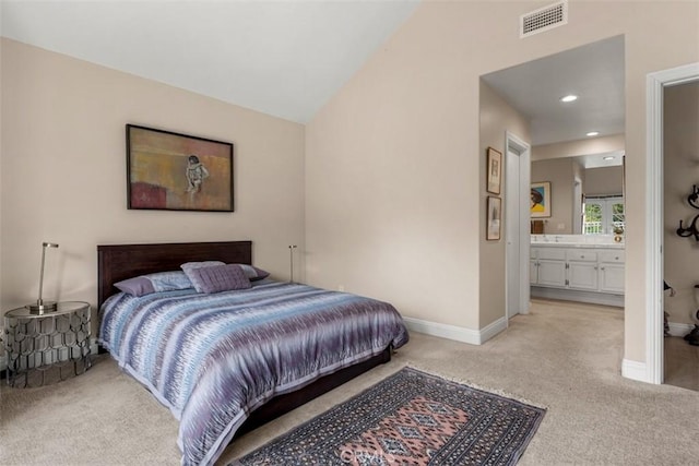 20 Delphinus Unit 20, Irvine, CA 92603 - bedroom featuring visible vents, light colored carpet, baseboards, ensuite bathroom, and recessed lighting