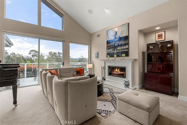 20 Delphinus Unit 20, Irvine, CA 92603 - carpeted living room featuring high vaulted ceiling, a glass covered fireplace, recessed lighting, baseboards, and visible vents