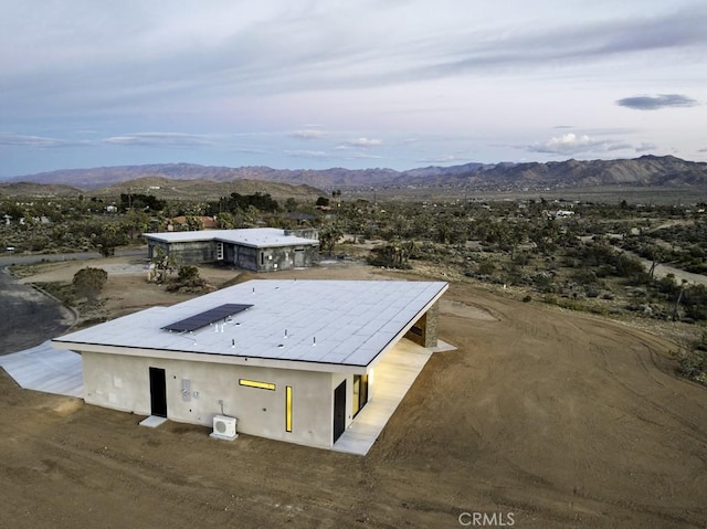 drone / aerial view featuring a mountain view
