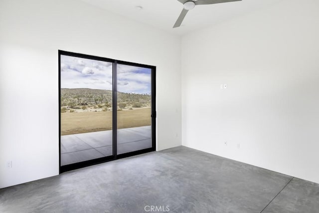 unfurnished room with concrete floors and ceiling fan