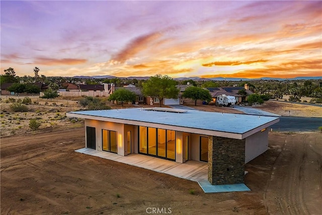 rear view of property with a mountain view