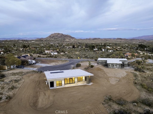 birds eye view of property with a mountain view