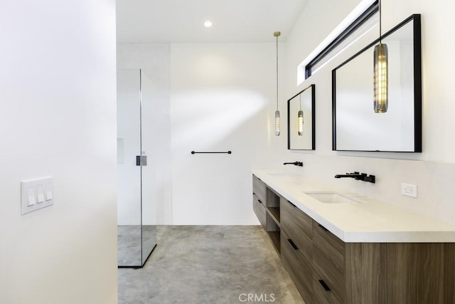 bathroom featuring double vanity, walk in shower, a sink, and recessed lighting