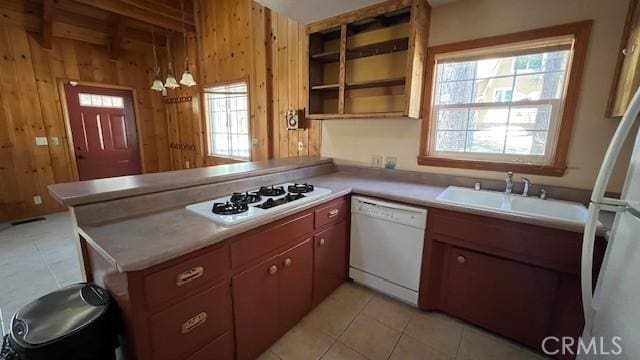 33411 Weeping Willow Dr, Green Valley Lake, CA 92341 - kitchen with white appliances, a sink, wooden walls, a peninsula, and light tile patterned floors