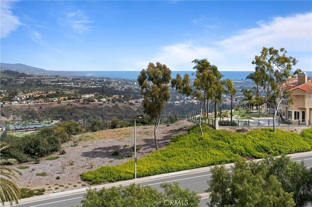 surrounding community featuring a water view
