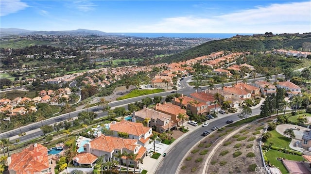 birds eye view of property with a mountain view and a residential view