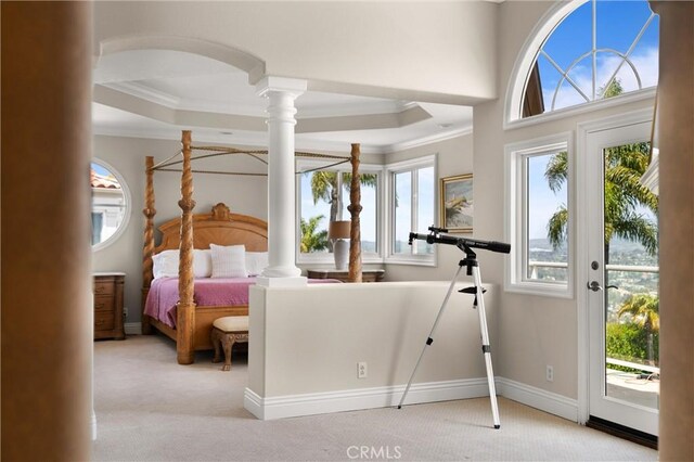 bedroom featuring carpet, decorative columns, ornamental molding, and access to exterior