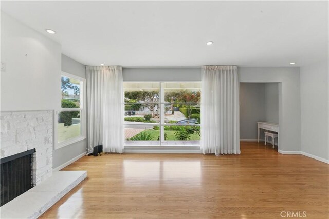 544 Calle Mayor, Redondo Beach, CA 90277 - unfurnished living room featuring a stone fireplace, wood finished floors, and recessed lighting