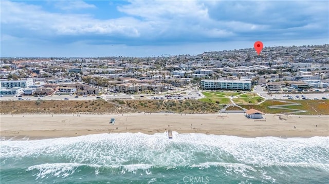 aerial view with a water view and a view of the beach