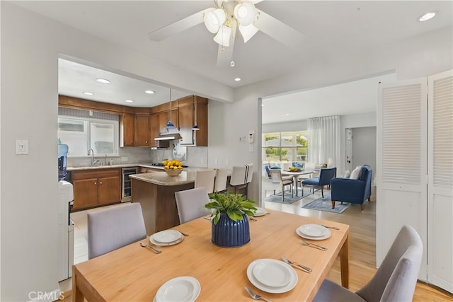 544 Calle Mayor, Redondo Beach, CA 90277 - dining space with wine cooler, recessed lighting, light wood finished floors, and ceiling fan