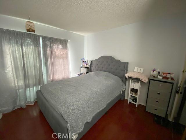bedroom featuring wood finished floors