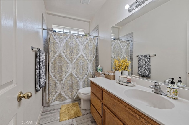 2081 Tangerine Ave, Madera, CA 93637 - bathroom with vanity, toilet, and a shower with shower curtain
