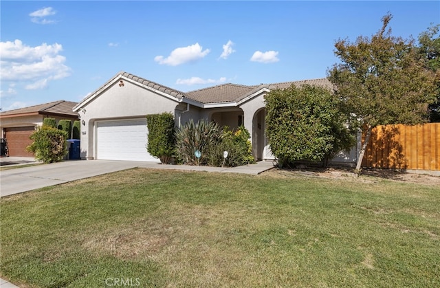 2081 Tangerine Ave, Madera, CA 93637 - view of front of property featuring a tiled roof, a garage, stucco siding, and driveway
