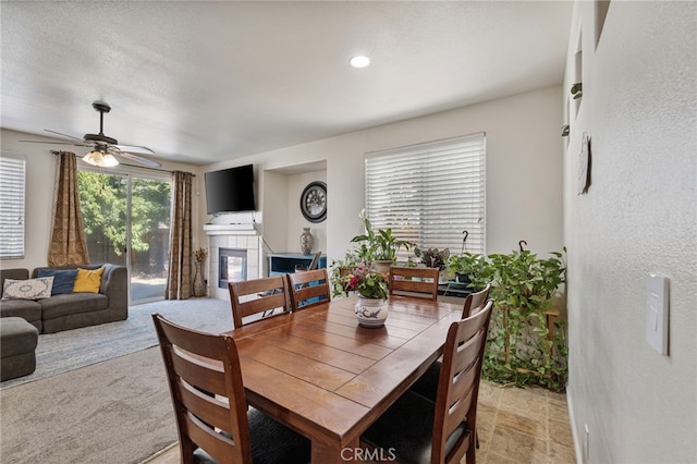 2081 Tangerine Ave, Madera, CA 93637 - dining room with a fireplace and ceiling fan
