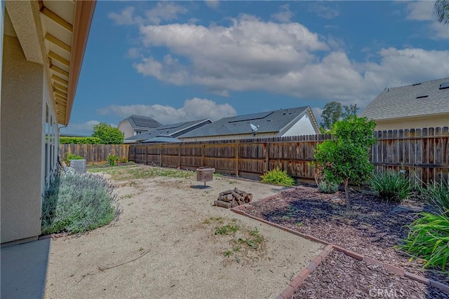 4154 Tudal Ave, Merced, CA 95348 - fenced backyard with a patio area