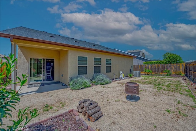 4154 Tudal Ave, Merced, CA 95348 - back of property with stucco siding, a fenced backyard, and cooling unit
