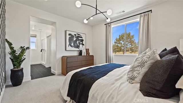 carpeted bedroom with baseboards, visible vents, an inviting chandelier, and tile patterned flooring