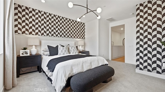bedroom with carpet floors, visible vents, recessed lighting, and a chandelier