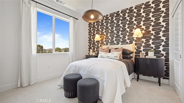 carpeted bedroom with baseboards and visible vents