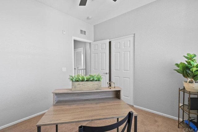 home office featuring baseboards, a ceiling fan, and carpet flooring