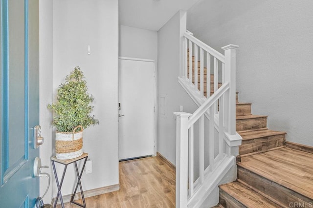 stairs with wood finished floors