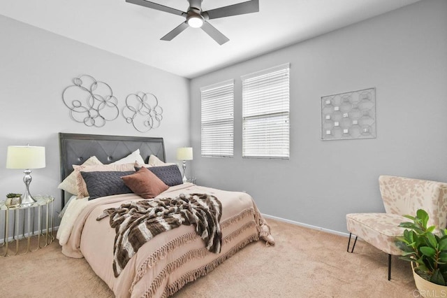 bedroom featuring a ceiling fan, baseboards, and carpet