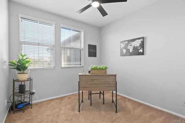 office featuring carpet flooring, a ceiling fan, and baseboards
