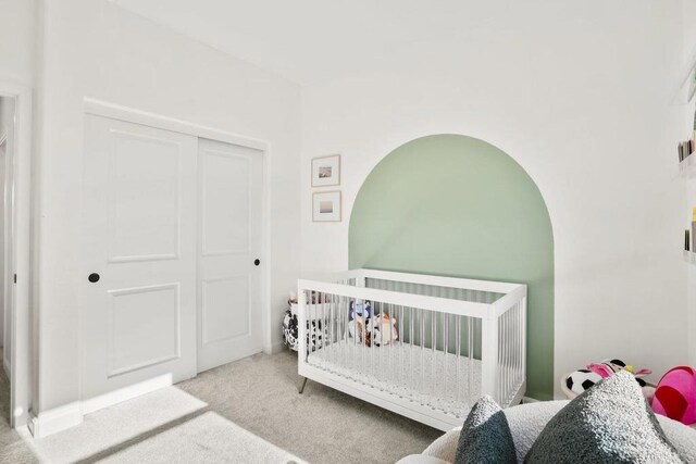 16755 Coyote Bush Dr Unit 32, San Diego, CA 92127 - carpeted bedroom with a crib and a closet