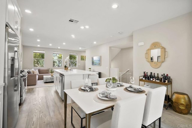 16755 Coyote Bush Dr Unit 32, San Diego, CA 92127 - dining space featuring light wood-style floors and recessed lighting