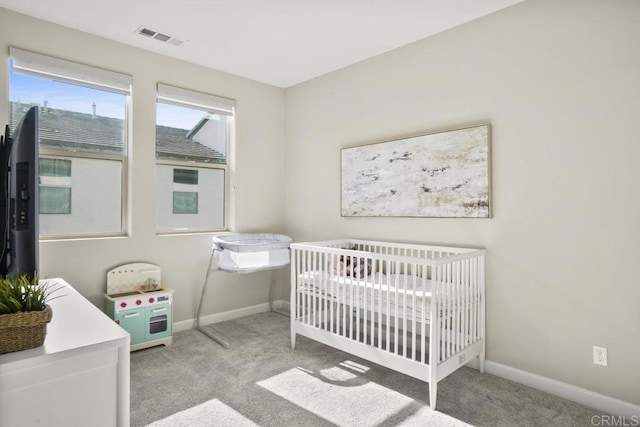 16755 Coyote Bush Dr Unit 32, San Diego, CA 92127 - bedroom with carpet, baseboards, and a nursery area