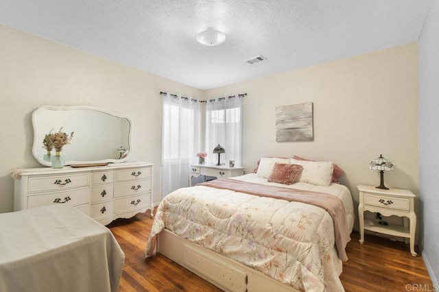 4580 60th St, San Diego, CA 92115 - bedroom with dark wood-type flooring and a textured ceiling