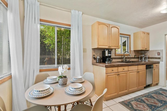 4580 60th St, San Diego, CA 92115 - kitchen featuring light brown cabinetry, a sink, dark countertops, decorative backsplash, and light tile patterned floors