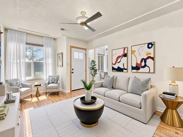4580 60th St, San Diego, CA 92115 - living room featuring a ceiling fan and light wood-type flooring