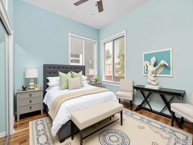 4580 60th St, San Diego, CA 92115 - bedroom with light wood-style floors and a ceiling fan