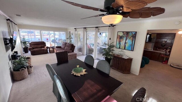 3621 Vista Campana S Unit 56, Oceanside, CA 92057 - carpeted dining area featuring ornamental molding and ceiling fan